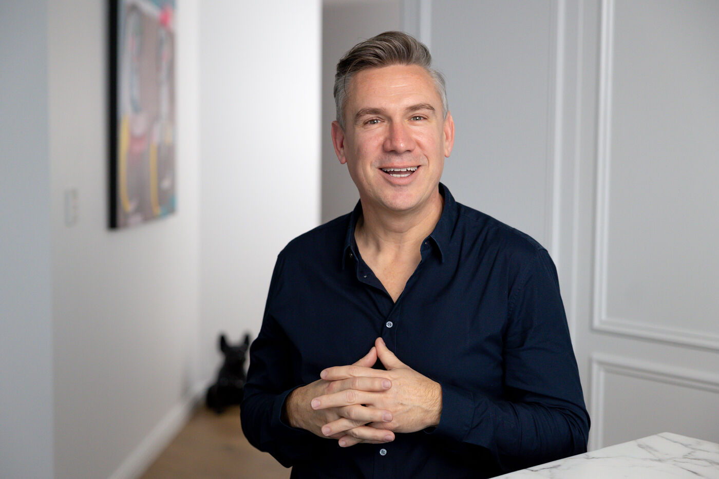 Rod Soper in conversation, hands clasped